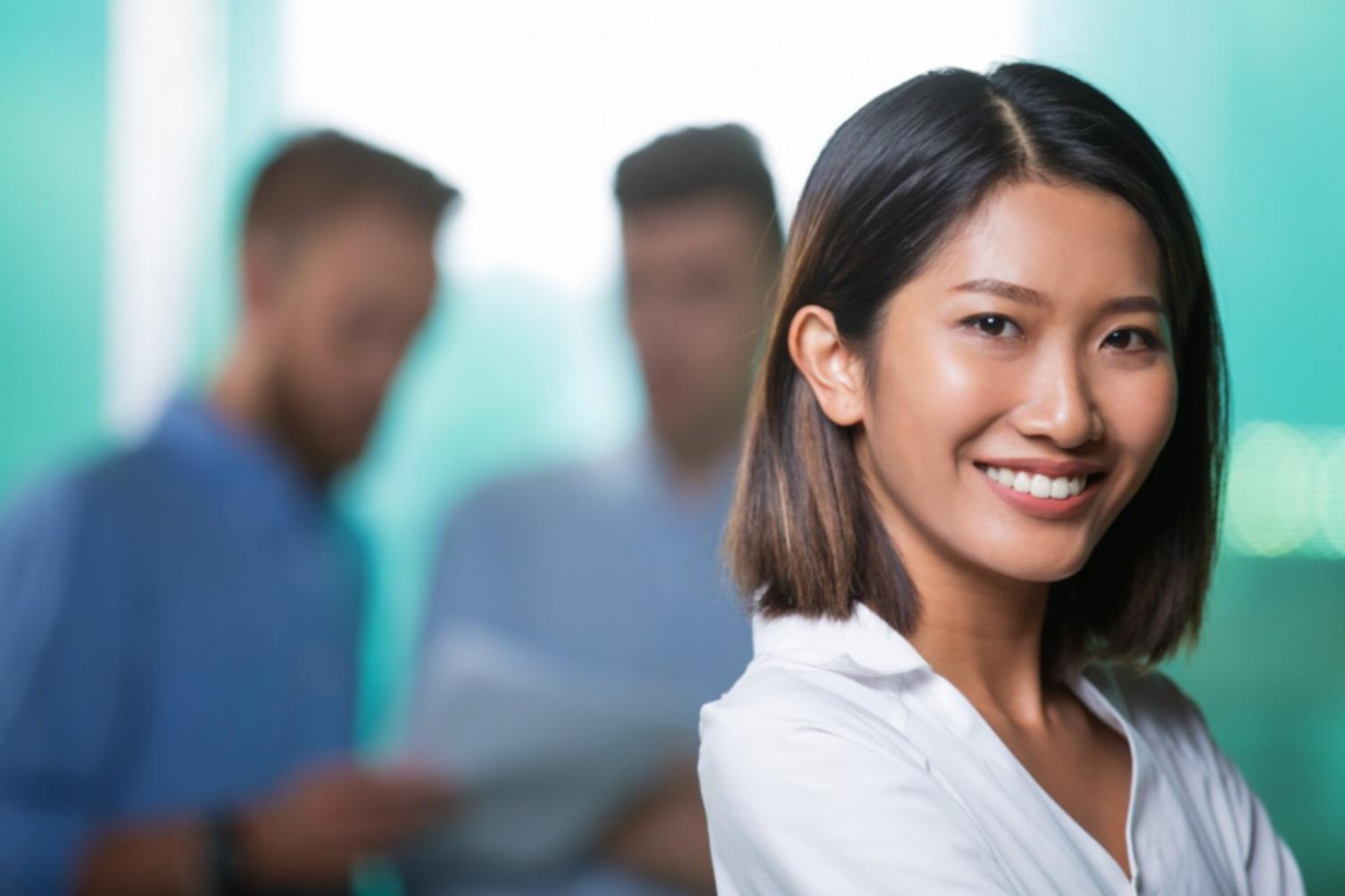 Corporate finance analyst reviewing complex financial models and Korean market data