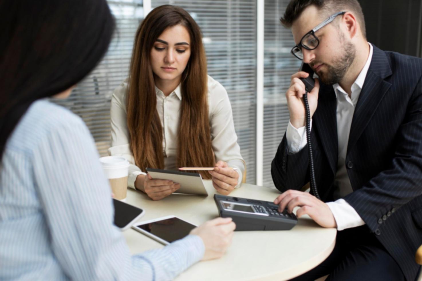 Financial professionals analyzing corporate data in modern Seoul office environment